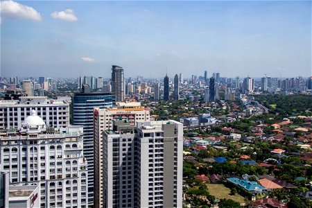 Manila Skyline Beyond High Rise Buildings photo