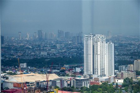 City Skyline Beyond Tall White Building photo
