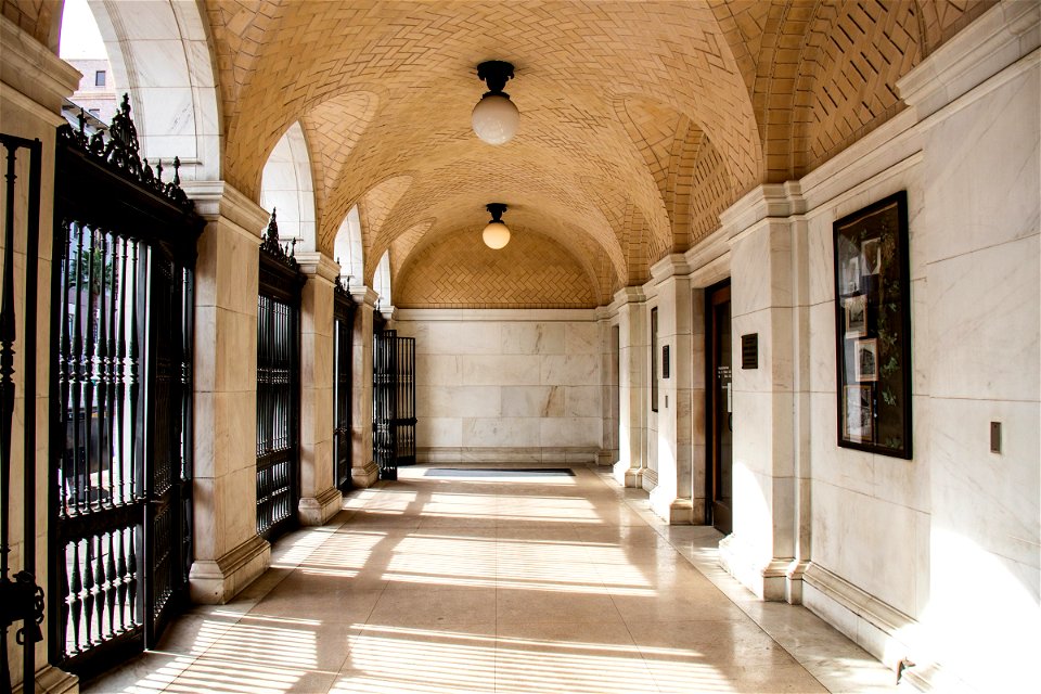Arched Passageway With Wrought Iron Gates photo