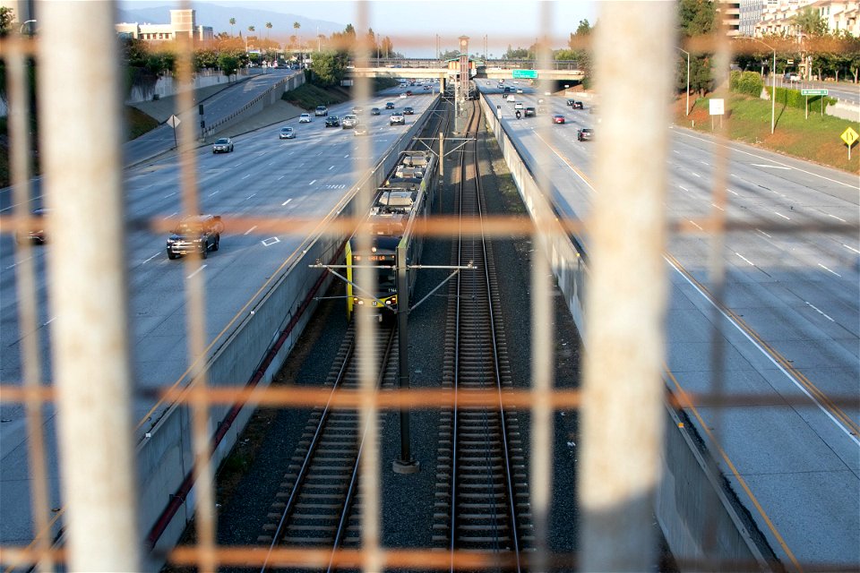 Train Between Traffic In Highway photo