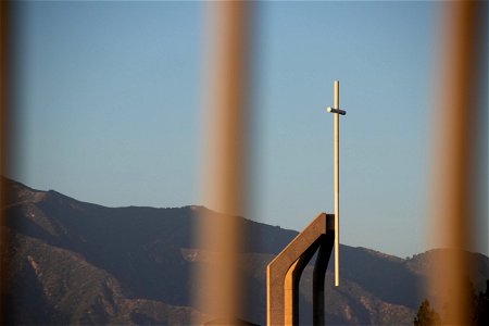 Mountain Beyond Concrete Structure With Cross