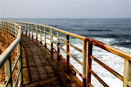 Rusty Guardrail Bordering Coastal Path photo