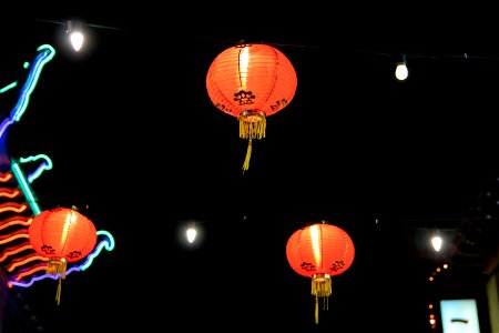 Illuminated Red Paper Lanterns Against Night Sky photo