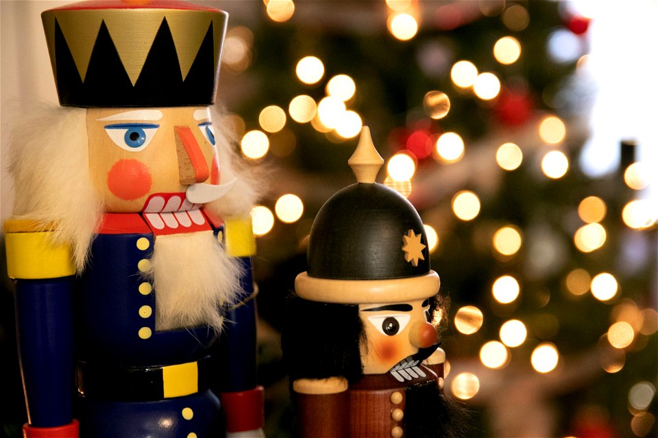 Nutcrackers Near Lit Christmas Tree
