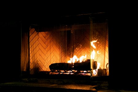 Flickering Wood Fire In Fireplace photo