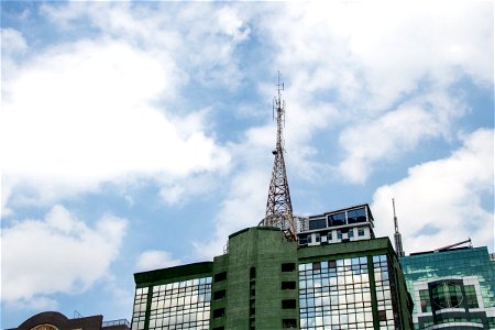 Radio Tower On Glass And Concrete Building