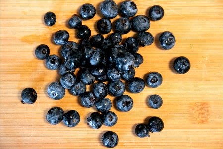 Blueberries On Wood Surface photo