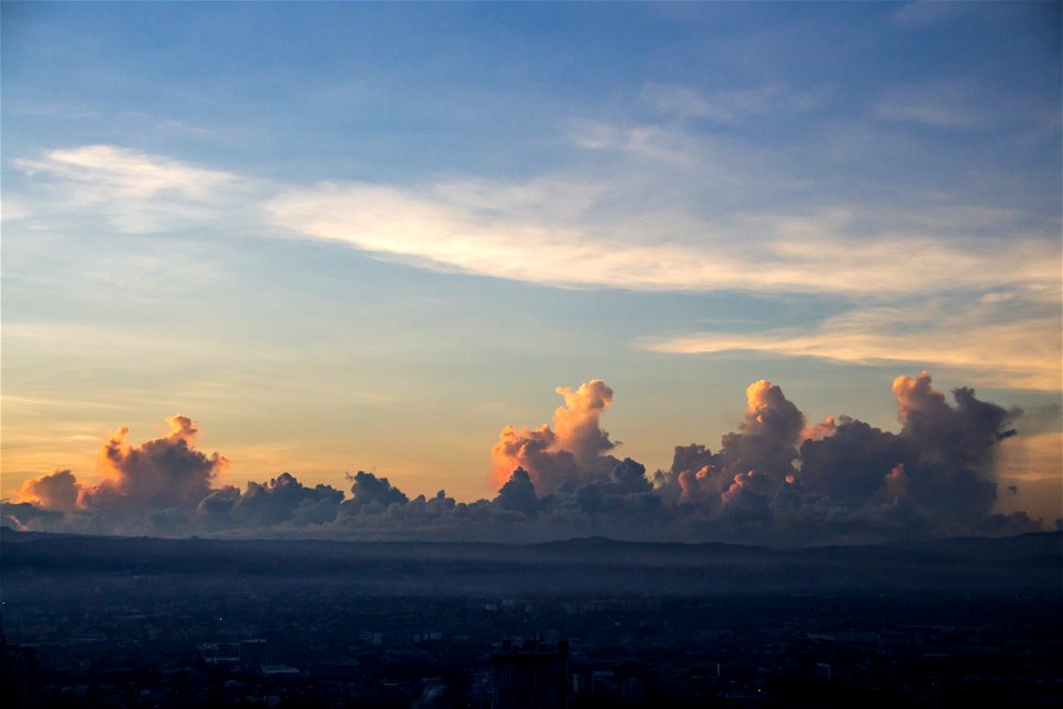 Clouds During Sunset Above Urban Area photo