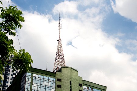 Radio Tower On Top Of Building photo