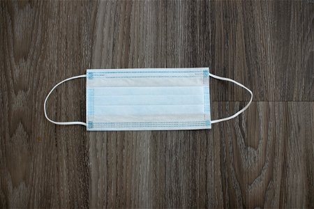 Surgical Face Mask On Wood photo