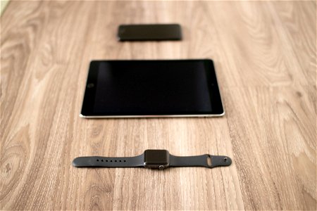 Apple Tech Products On Wooden Surface
