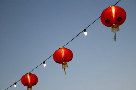 Round Chinese Paper Lanterns On String Lights photo