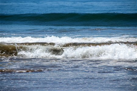 Small Waves Crashing On Shore
