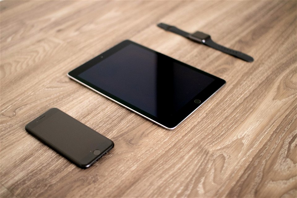 Apple Tech Products On Wooden Surface