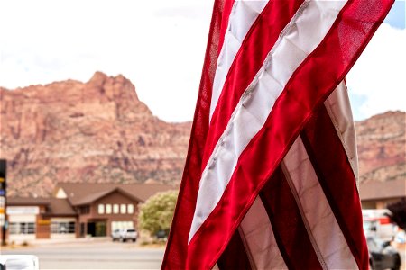 Stripes Of American Flag Against Mountains photo