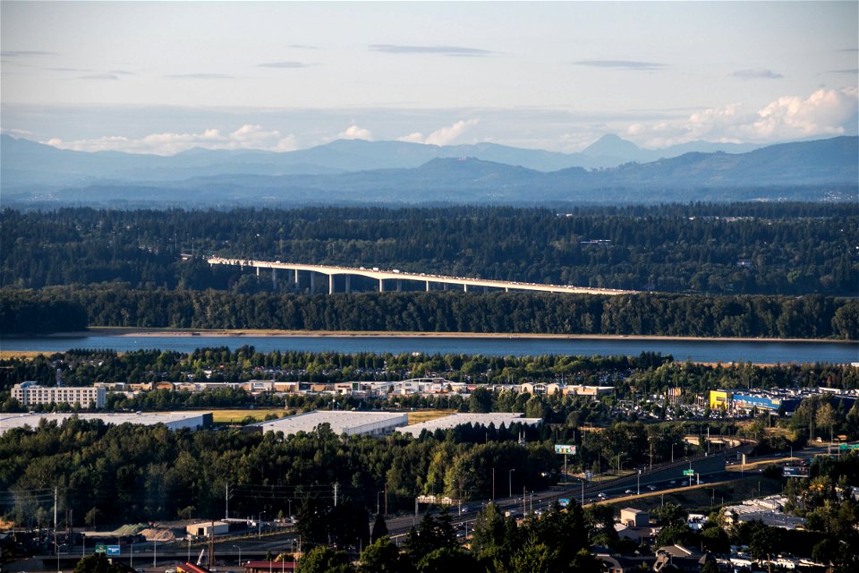 View Of Urban Area Near River And Forest photo