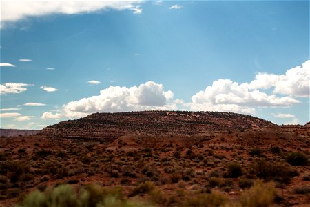 White Clouds Above Mountain In Desert