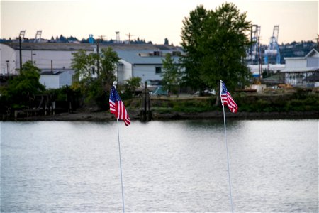 Two Small American Flags Near Water