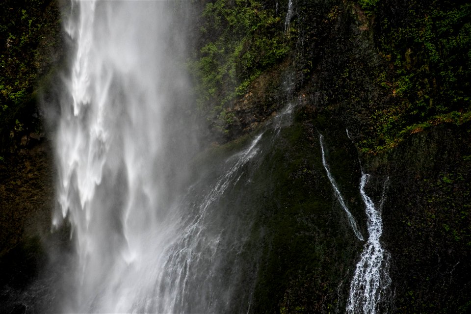 Misty Waterfall On Mossy Cliff