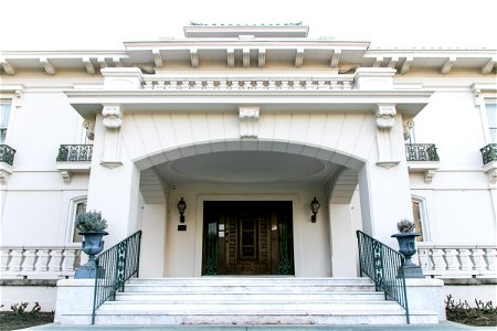 Stairway Entrance Of Large White Mansion photo