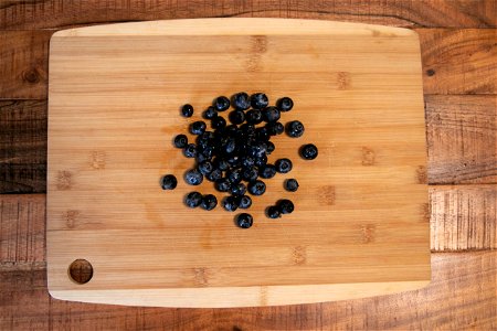 Blueberries On Wooden Cutting Board photo