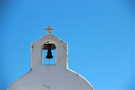 Church Bell Tower Against Clear Sky photo
