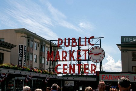 Signs And Clock In Pike Place Market