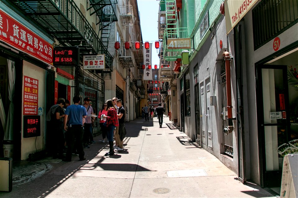 Group Of People Standing In Chinatown Street photo