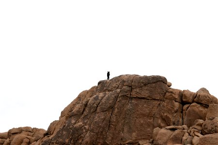 Single Man On Rock Formation photo