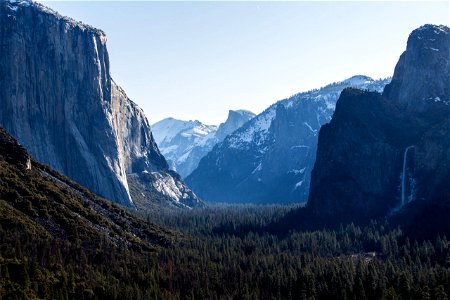 Massive Mountains Near Forest In Yosemite Park photo