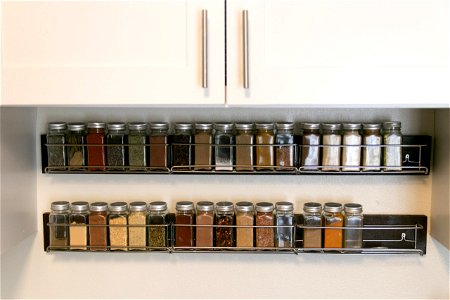 Small Jars Of Spices On Rack Organizer photo