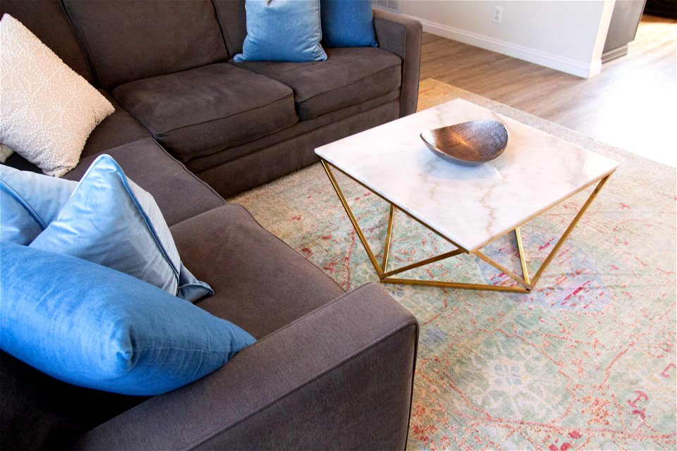 Living Area With Sectional Sofa And Coffee Table