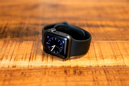 Smart Watch On Wooden Surface photo