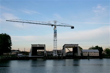Tower Crane Between Buildings Near Water photo