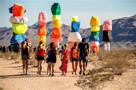 People Around Colorful Boulder Art Installation