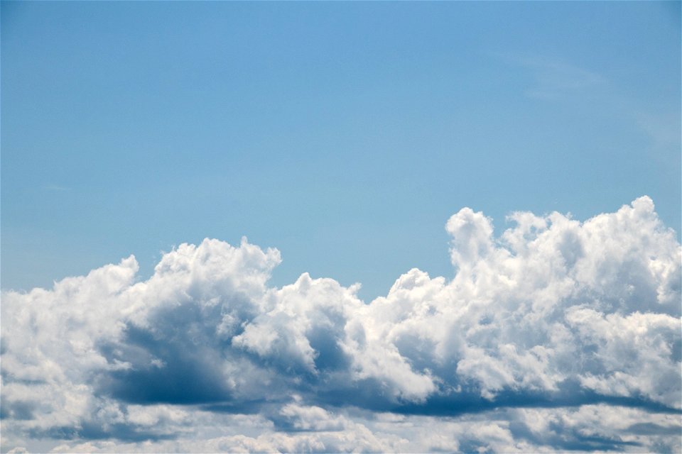 Compact Clouds In Blue Sky photo