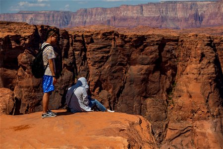 Two People Near Desert Mountain Cliff photo