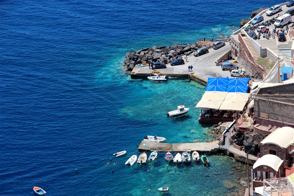 Small Boats In Rocky Shore Port