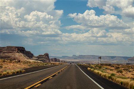 Highway In Desert Near Mountains photo