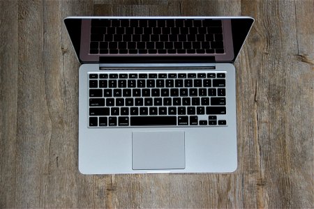 Open Laptop On Wooden Surface