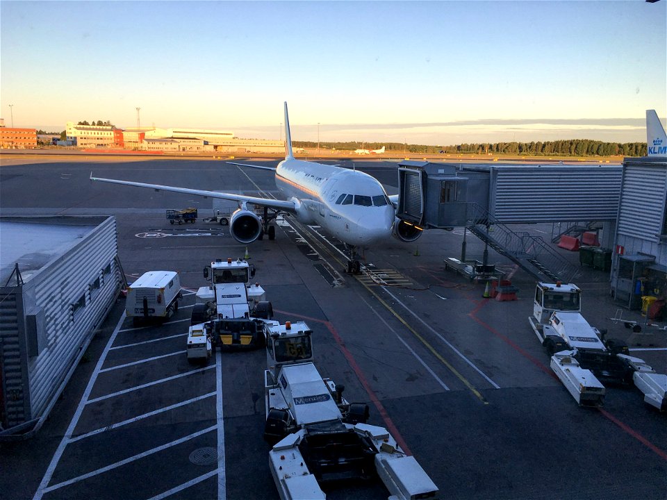 Parked Plane On Airport Ramp