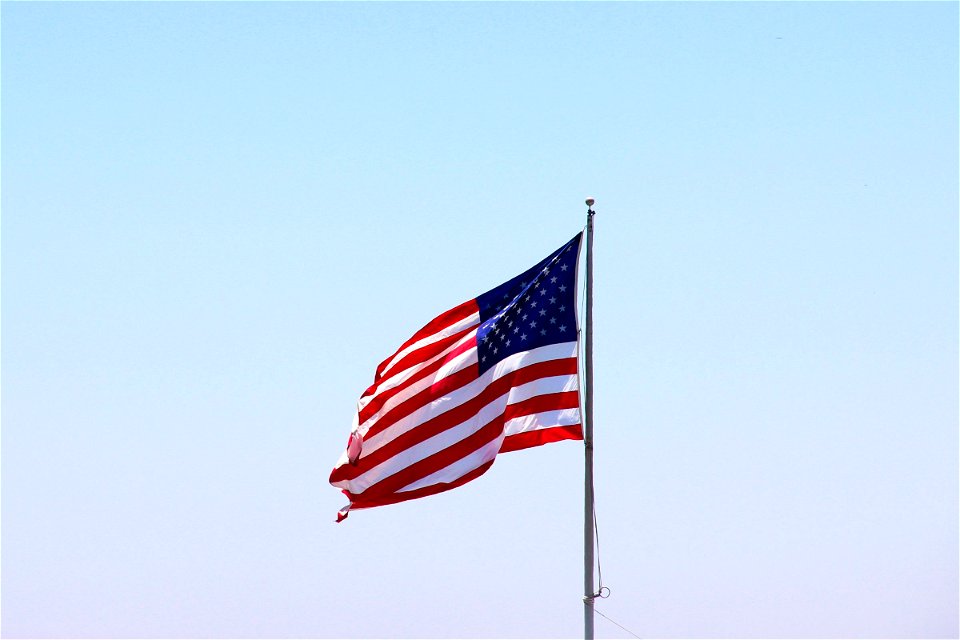 Waving American Flag On Pole