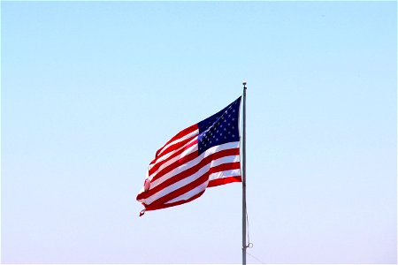 Waving American Flag On Pole photo