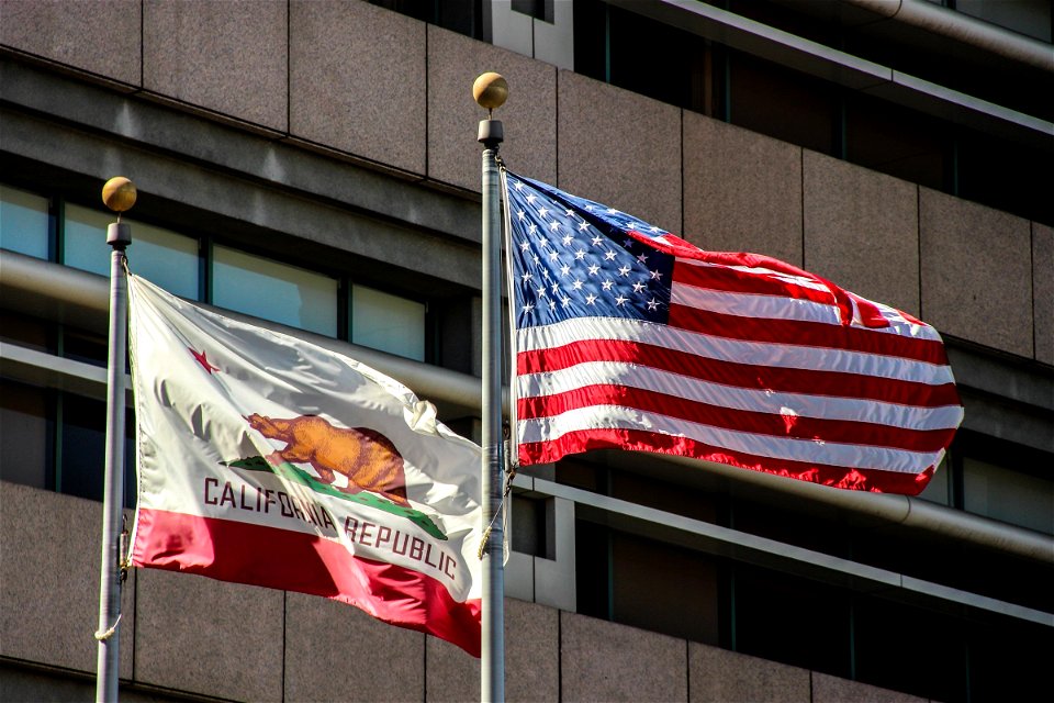 American And California State Flags On Poles