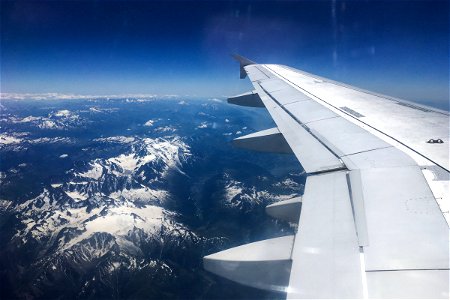 Airplane Wing Over Mountains photo