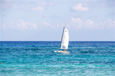 Sailing Dinghy In Middle Of Water photo