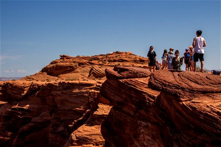 Tourists On Top Of Rock Formations photo