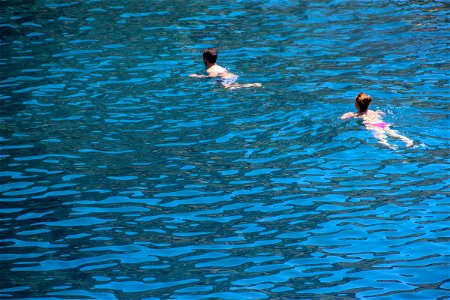 Man And Woman Swimming In Water photo