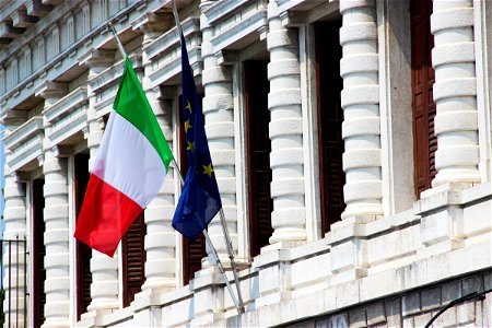 Two Flags On Old Building