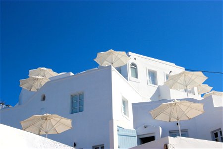 White Terrace Umbrellas In White Building